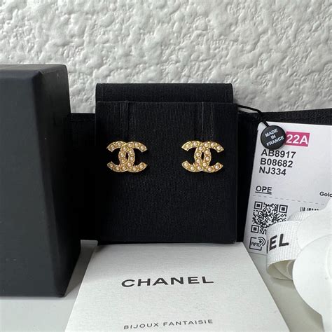 chanel symbol stud earrings|Chanel logo earrings white gold.